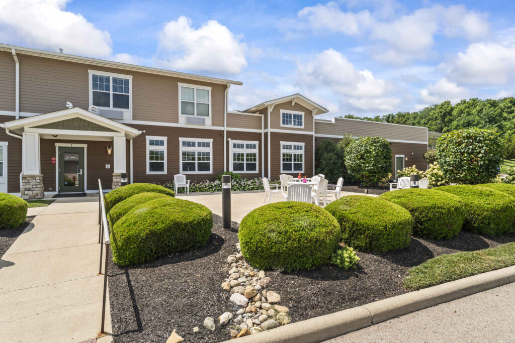 A walkway next to an outdoor patio area for residents